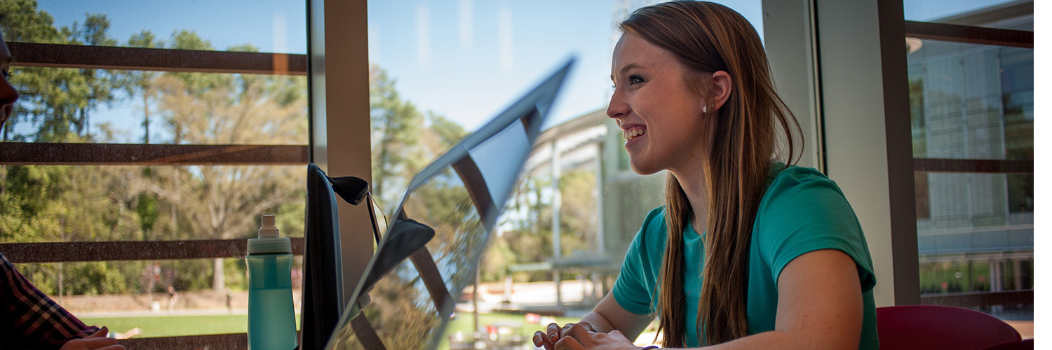 Some stock photo of a student studying at Talley Student Center